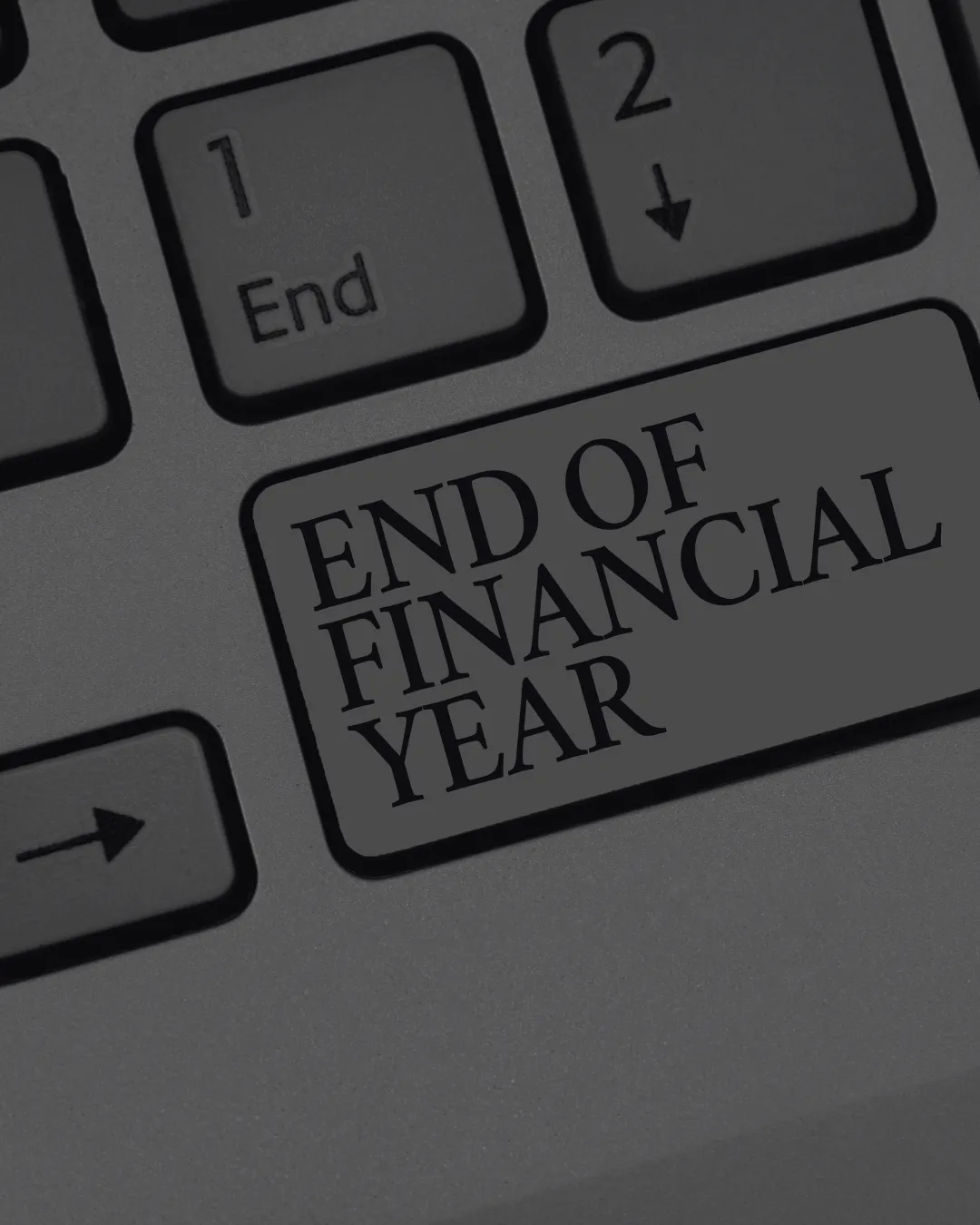 A computer keyboard key labelled end of financial year