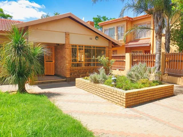 Established brick house with garden and driveway