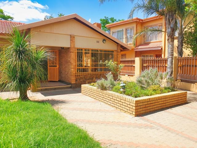 Established brick house with garden and driveway