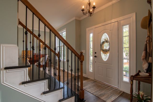 Timber staircase and entry hallway inside an older home
